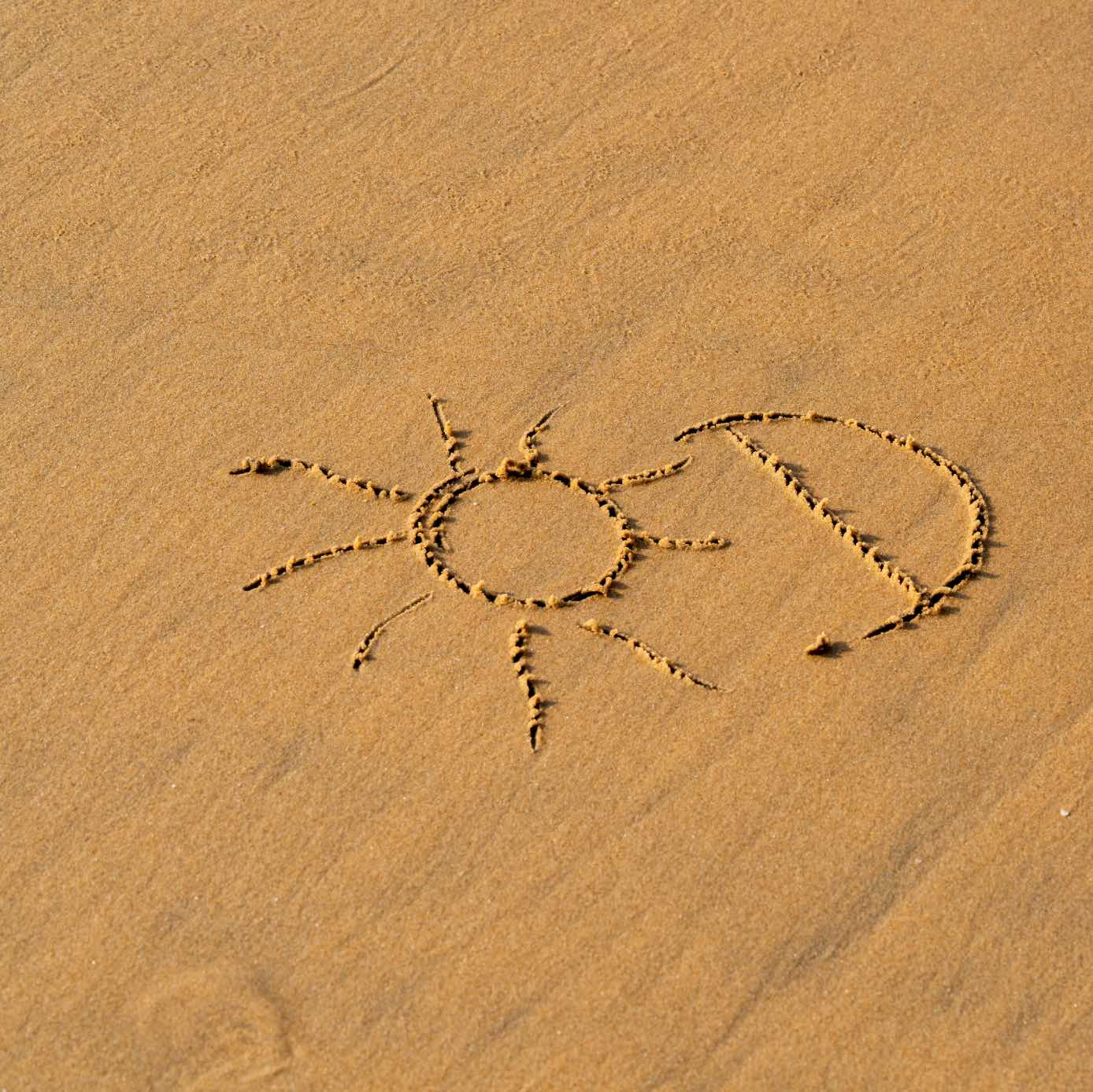 plaz, vitamin D napisane v piesku